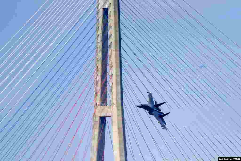 A Sukhoi Su-35S fighter jet of the Russian Eastern Military District performs a test flight over Ajax Bay by Russky Island on September 5. (TASS/Yury Smityuk)