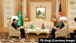 Afghan President Ashraf Ghani (R) with Turkmen President Gurbanguly Berdymukhammedov in Astana on February 21.