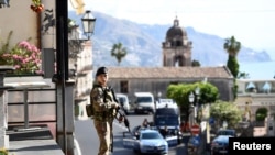 A military guard stands watch at the Group of Seven (G7) in Taormina, Sicily May 26, 2017
