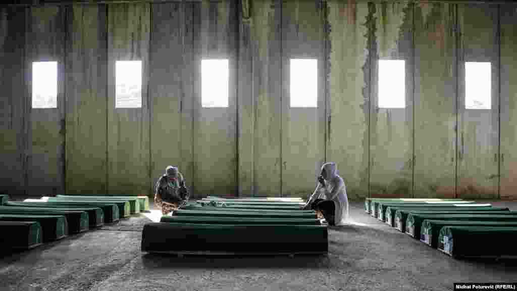 Coffins&nbsp;with 71 victims of the Srebrenica massacre await burial on July 11, 2017. Every year, more bodies are buried as remains are identified.&nbsp;In November, former Bosnian&nbsp;Serb commander Ratko Mladic was&nbsp;found guilty of genocide&nbsp;at Srebrenica by&nbsp;a UN tribunal.&nbsp;(RFE/RL, Midhat Poturovic)