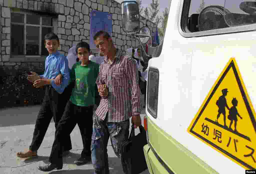 Blind students leave the Kabul Blind School.