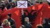 An ethnic Albanian protester objects to the asterisk at a demonstration in Pristina in February 2012.