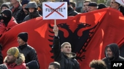 An ethnic Albanian protester objects to the asterisk at a demonstration in Pristina in February 2012.