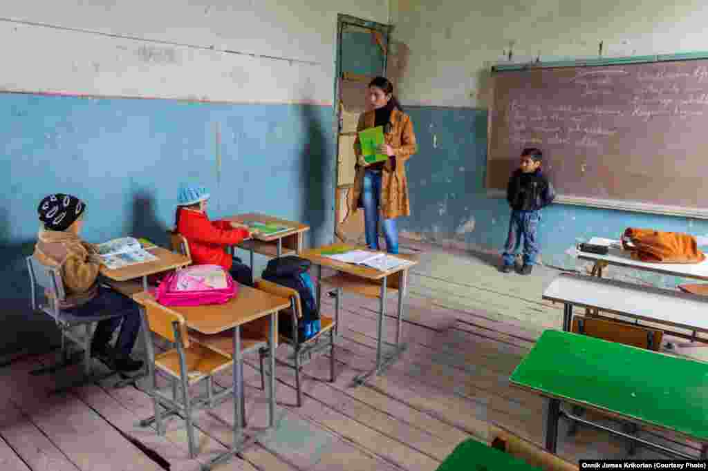 An ethnic Armenian teacher, fluent in Azeri, teaches the Georgian language to a class of Azeri first-graders.