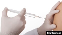 Generic -- Female doctor injecting child