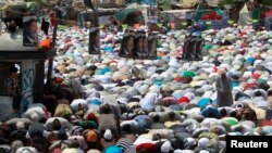 Supporters of ousted Egyptian President Mohamed Mursi perform Friday prayers during a protest in Cairo on July 19. (file photo)