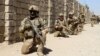 Afghan National Army commandos take positions during a military operation in 2016.