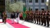 Afghan President Ashraf Ghani and Pakistani Prime Minister Shahid Khaqan Abbasi inspect the honor guard at the presidential palace in Kabul on April 6.
