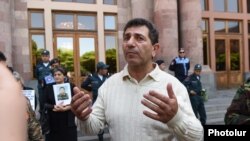 Armenia -- Retired colonel Volodya Avetisian, a war veteran and activist who was set free from prison today, holds a protest near the central government offices in Republic Square, Yerevan. 25May, 2017