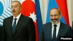 Russia - Armenian Prime Minister Nikol Pashinian and Azerbaijani President Ilham Aliyev pose for a photograph at a summit in Saint Petersburg, December 6, 2018.
