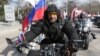 Aleksandr Zaldostanov, the leader of the Night Wolves biker group, takes part in a commemoration ceremony for soldiers killed during World War II memorial in Sevastopol, Crimea, in March.