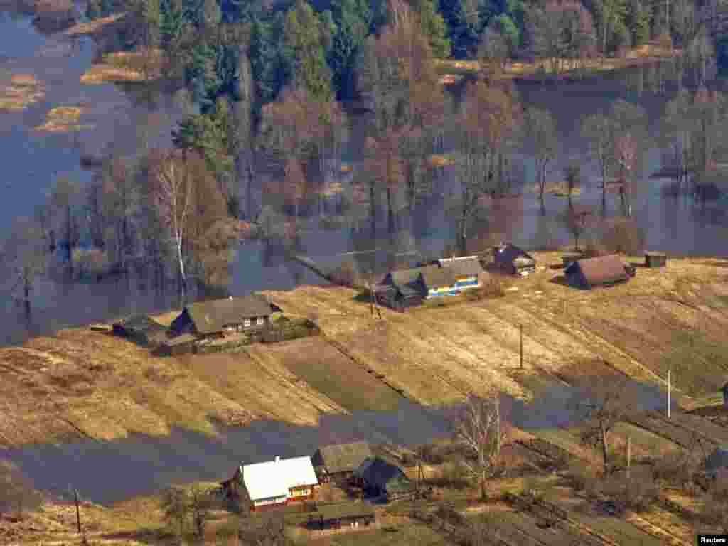 A view of a flooded village on the Neman River near the city of Hrodno on March 31. - Melting snow has caused flooding in parts of Ukraine and Belarus. Photo by Aleksandr Sayenko for Reuters