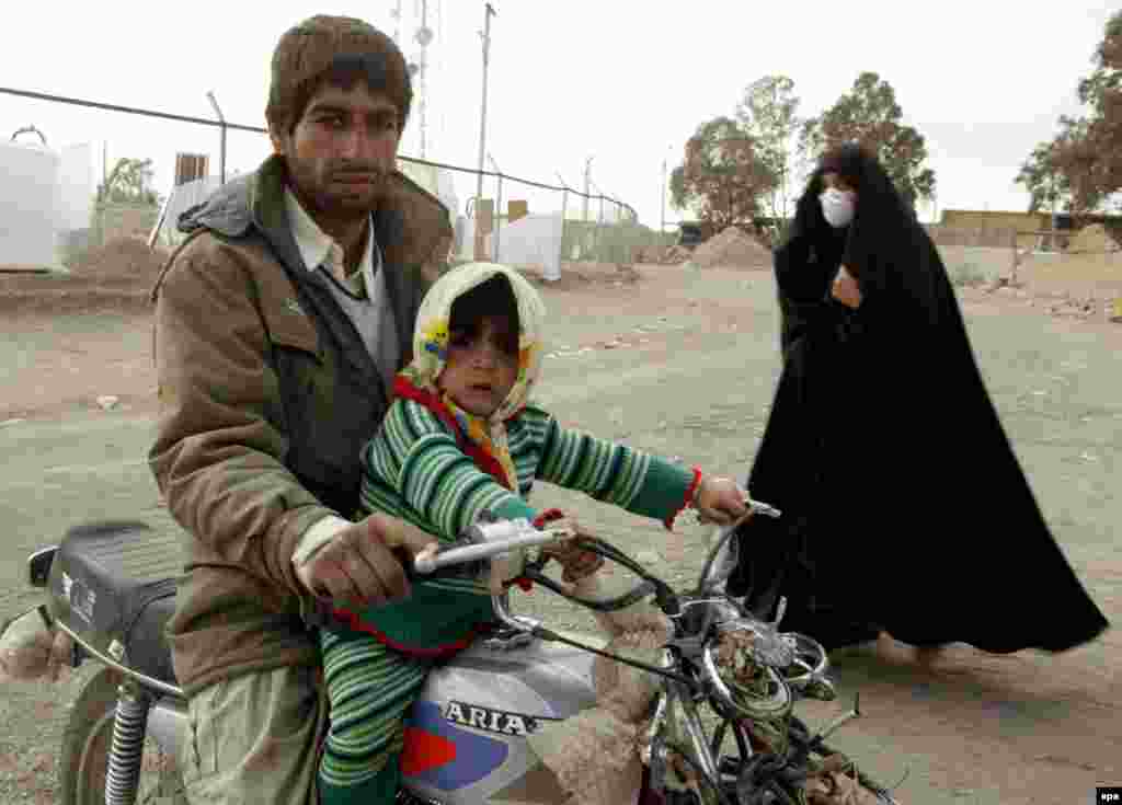 A Bam resident and his daughter on January 2, 2004 (epa) - The earthquake struck at 5:27 a.m. local time on Saturday, December 26, 2004. Experts believe the epicenter was very close to the city of Bam and that the earthquake occurred close to the surface, intensifying the damage.