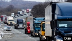 Truckers across Russia have been holding slow-moving protests against a road-use fee, which they say will drive them out of business. 