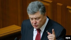 President Petro Poroshenko told parliament on June 4 that more than 9,000 Russian soldiers are currently in Ukraine, and that Ukraine's military must be prepared for the possibility of "a full-scale invasion along the entire length of the border with Russia."