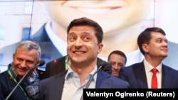 Volodymyr Zelenskiy reacts following the announcement of the presidential election's first exit poll, at his campaign headquarters in Kyiv on April 21, 2019.