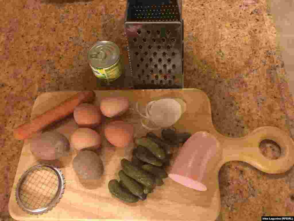 Those are the basic ingredients for the Russian salad that Russians call Salad Olivier. A can of pees (100 g), a boiled carrot, two small or one big boiled potato, 4 boiled eggs, salted pickles (home made in my case), 2 slices of sweet onion and 200 g of ham (or Mortadella type of sausage, or crab meat, of boiled beef tongue, or fish, or - in this case - typical Russian sausage called Doctor's - don't ask me why they gave this name to the sausage in the Soviet Union).