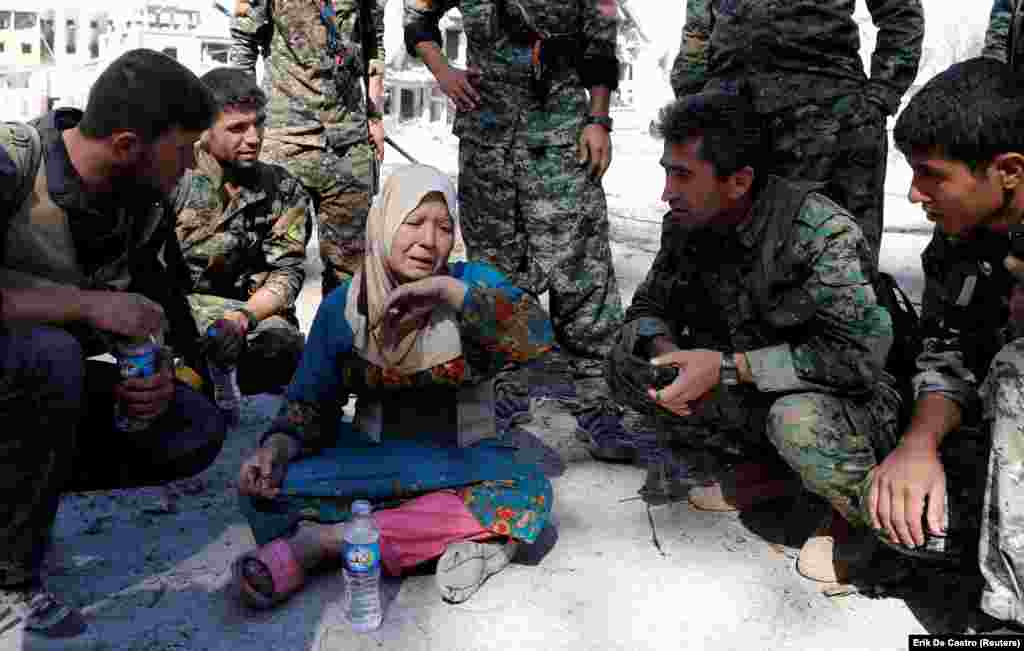 A woman cries after being rescued by fighters of Syrian Democratic Forces after Raqqa was liberated from Islamic State militants on October 17. (Reuters/Erik De Castro)