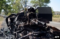 The remains of a destroyed APC on the side of the road leading to Ilovaisk on September 3