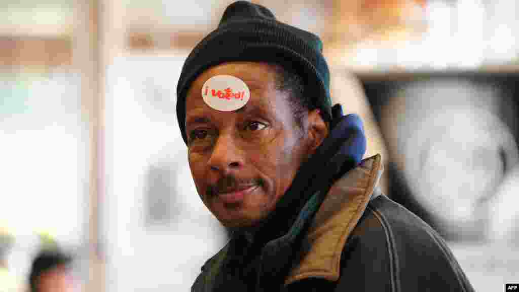 A voter wears an "I Voted" sticker on his forehead after casting his ballot at a polling station in Chicago, Illinois.