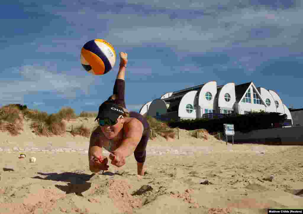 Volleyball player Victoria Palmer trains at Sandbanks Beach in Poole, England. (Reuters/Matthew Childs)