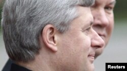 A file photo showing Canadian Prime Minister Stephen Harper (fore) with then-Ukrainian President Viktor Yanukovych at a welcoming ceremony in Kyiv in 2010.