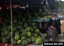 An Afghan street vendor sells watermelons during Ramadan in Kabul.
