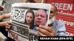 Pakistani newspapers carry front page news of the arrest of former Prime Minister Nawaz Sharif, in Karachi on July 14.