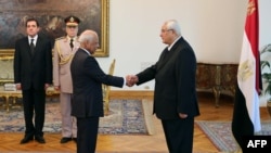 Interim President Adli Mansour (right) and interim Prime Minister Hazem el-Beblawi, at el-Beblawi's swearing-in on July 16.