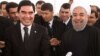 Turkmenistan's Gurbanguly Berdymukhammedov (left) and Iran's Hassan Rohani in happier times