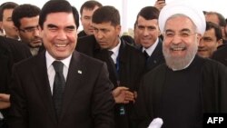 Turkmenistan's Gurbanguly Berdymukhammedov (left) and Iran's Hassan Rohani in happier times