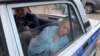 Гульназ Равилова в полицейской машине