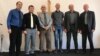 Seventy-one-year-old pastor Yury Korniyenko (seen here third from left with other congregation members) received a court summons and was subsequently charged with engaging in illegal missionary work.