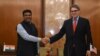 Indian Minister for Petroleum and Natural Gas Dharmendra Pradhan (L) shakes hand with US Energy Secretary Rick Perry during a press conference in New Delhi on April 17, 2018. Perry is in India aiming to promote liquefied natural gas (LNG) and other energy