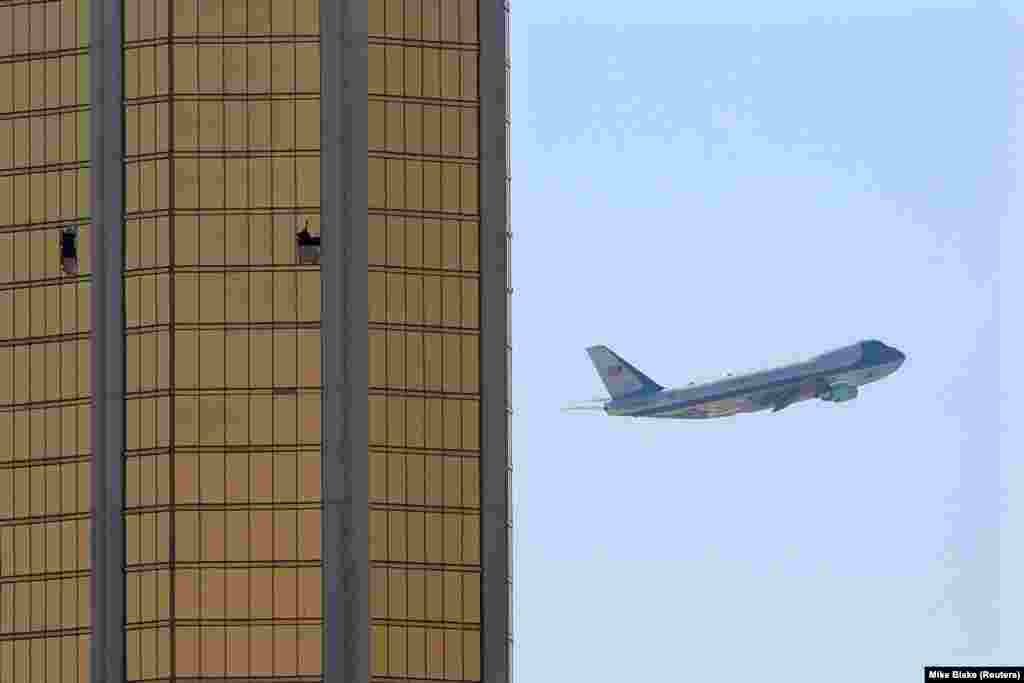U.S. President Donald Trump&#39;s plane, Air Force One, departs Las Vegas past the broken windows on the Mandalay Bay hotel from where shooter Stephen Paddock killed dozens of people on October 1. (Reuters/Mike Blake)