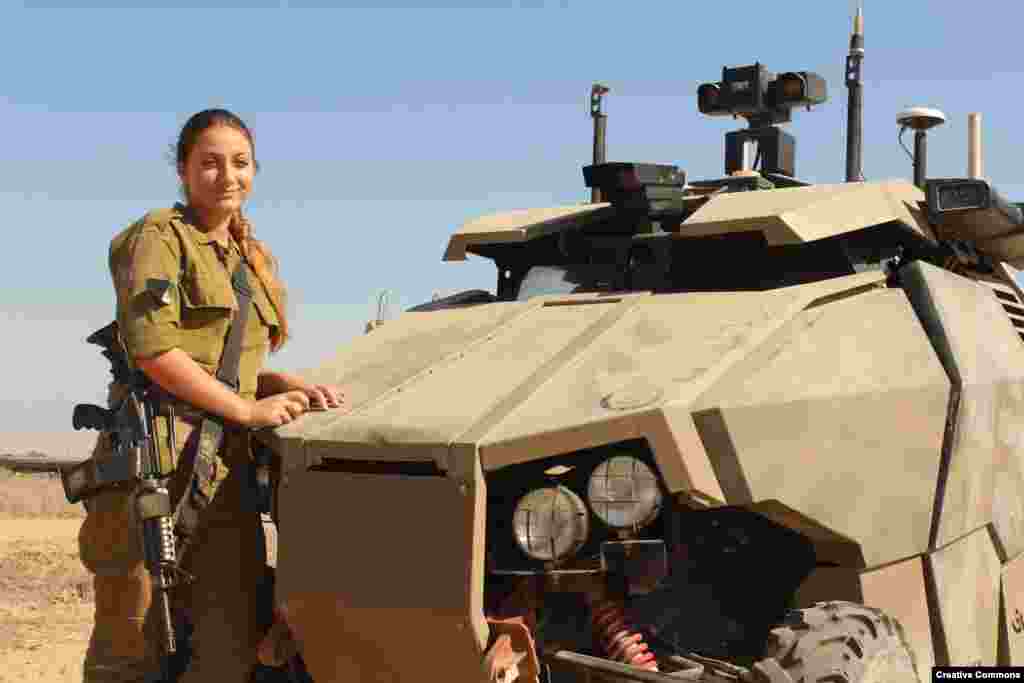 An Israeli soldier with the armor-plated Guardium. The vehicle can be fitted with an array of sensors and deliver hundreds of kilograms of cargo to troops under fire. Although the Guardium remains in service, the company behind the project wound down its development in 2016 citing a lack of international interest.