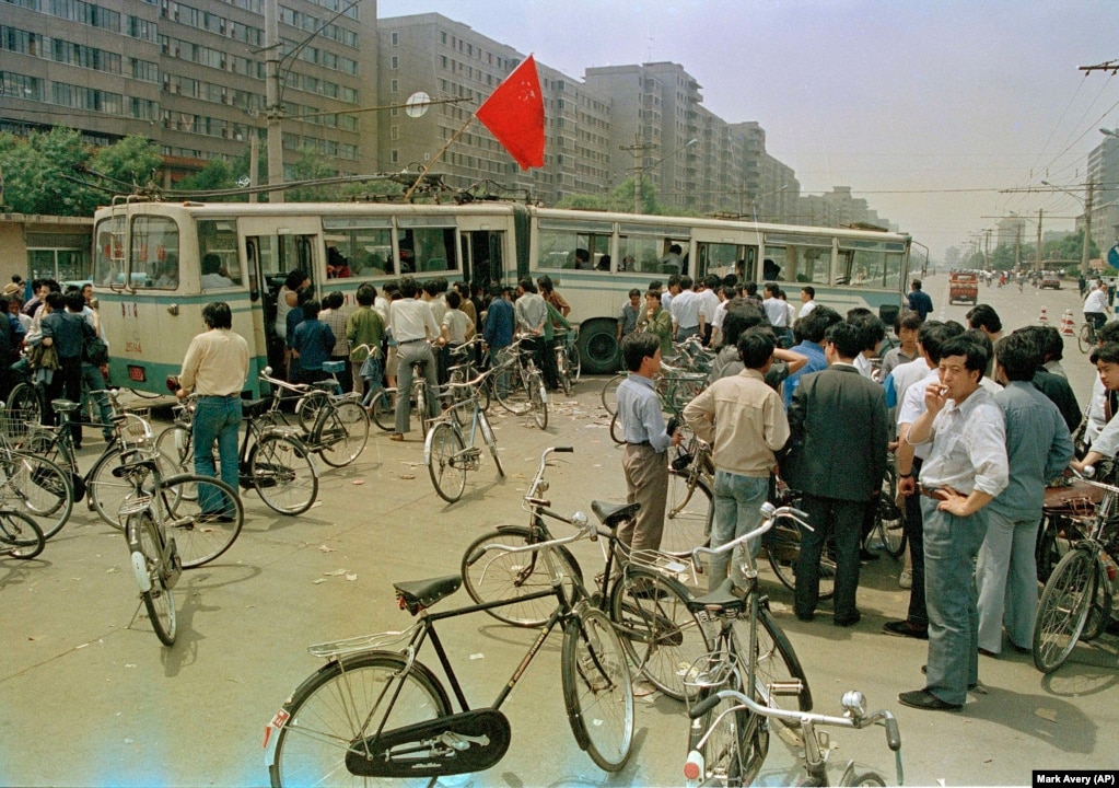 Buses are used by sympathizers to Beijing university students occupying Tiananmen Square to secure the city from government troops, May 22, 1989. Streets into and out of the city have been turned into obstacle courses. (AP Photo/Mark Avery)