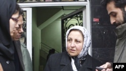 Shirin Ebadi leaves her office after authorities closed it down in December