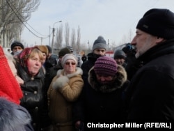 Donetsk Governor Pavlo Zhebrivskyy meets with townspeople at a humanitarian aid center in Avdiyivka.