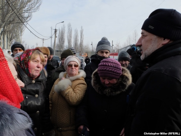 Donetsk Governor Pavlo Zhebrivskyy meets with townspeople at a humanitarian aid center in Avdiyivka.