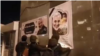 Protesters tearing Soleimani posters in Tabriz. January 12, 2020. 