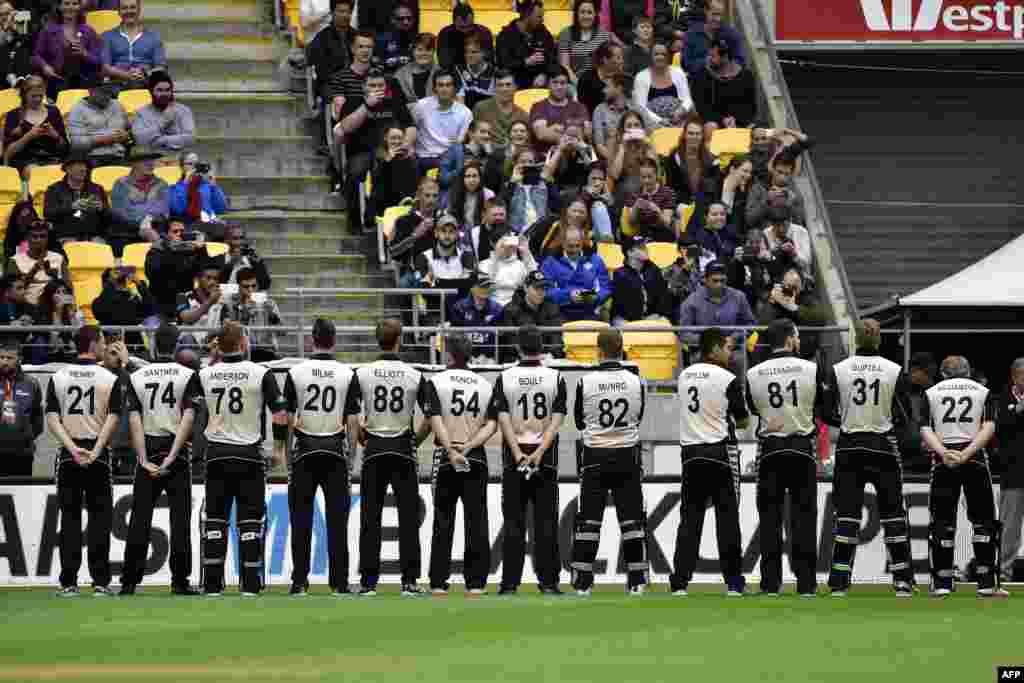 New Zealand -- New Zealand players stand for a moments silence for those killed in a terror attack in northwest Pakistan during the third T20 cricket match between New Zealand and Pakistan in Wellington at Westpac Stadium, January 22, 2016