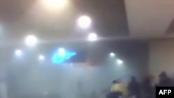 A smoke-filled area near the blast site at Moscow's Domodedovo international airport is shown on television.