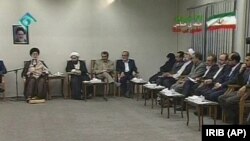 This image taken from video broadcast by Iran's IRIB televsion, in Tehran, Wednesday, June 17, 2009, shows Iran's Supreme Leader Ayatollah Ali Khamenei, 1st left, speaking at a meeting with representatives of presidential candidates.