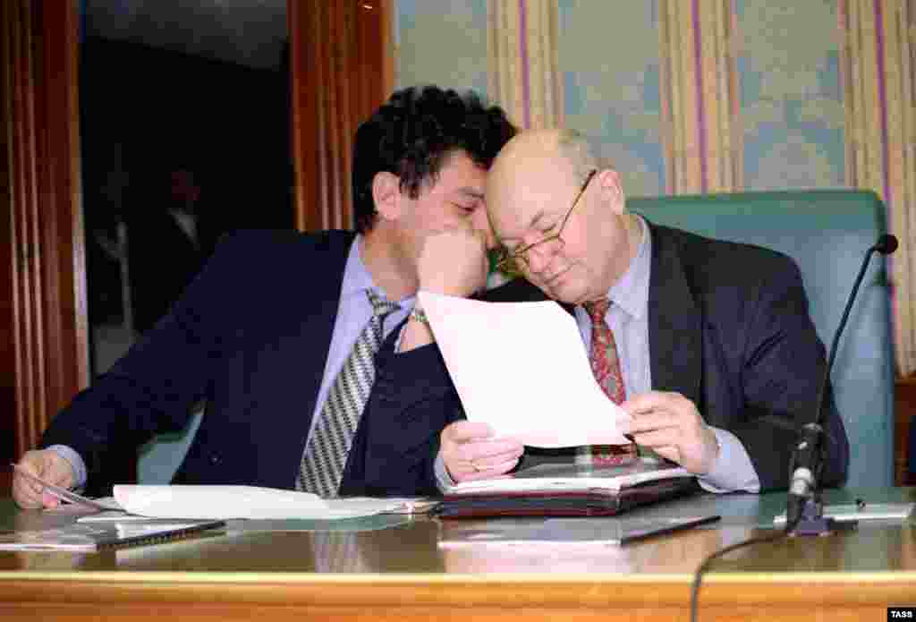 Luzhkov (right) and Nizhny Novgorod regional Governor Boris Nemtsov are pictured during a meeting of Russian governors held in the upper chamber of the Russian parliament on February 11, 1997. Nemtsov was shot dead in Moscow on February 27, 2015.