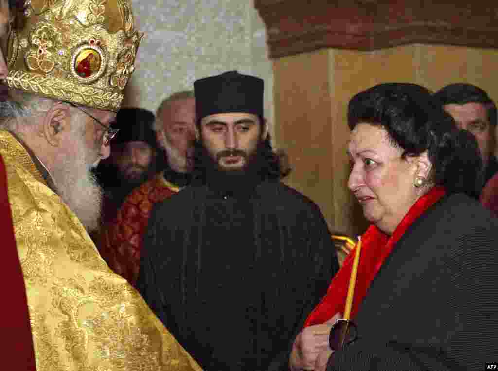 Montserrat Caballe (right) chats with Patriach Ilya II of the Georgian Orthodox Church on December 13, 2007, during a visit to the cathedral in Tbilisi, where she was to give a benefit concert for homeless children.