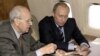 Ivan Martynushkin with Russian President Vladimir Putin on board the presidential plane on the way to Krakow, Poland, in 2005.