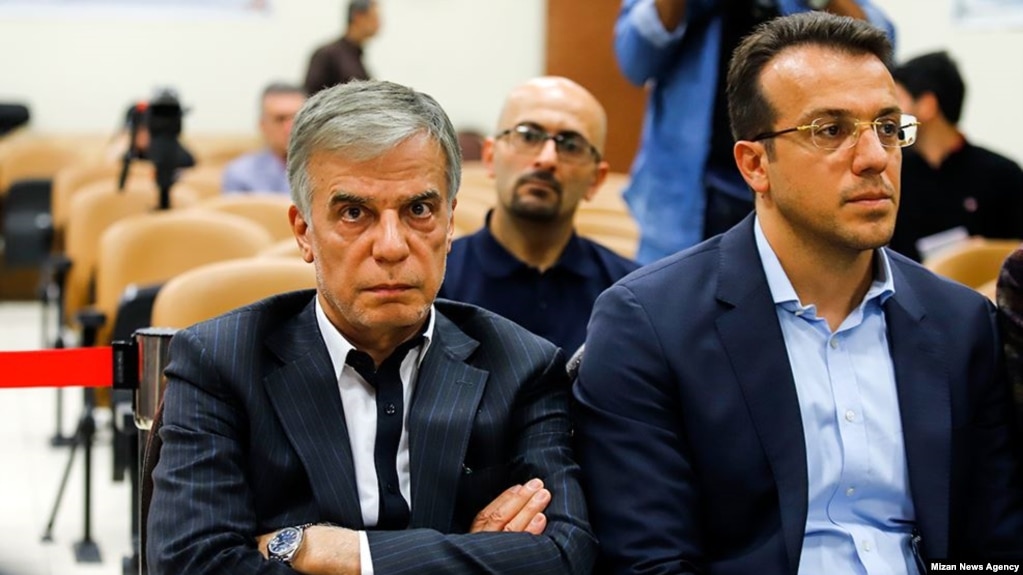 Abbas Iravani (L) is a well-known business man and a major sponsor of religious activities in Iran, appearing in court. Undated