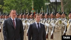 Presidents Ilham Aliyev (left) and Medvedev in Baku on July 3