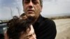 Georgia - A displaced woman from the town of Gori breaks down in tears while fleeing the South Ossetia bordering region, 12Aug2008